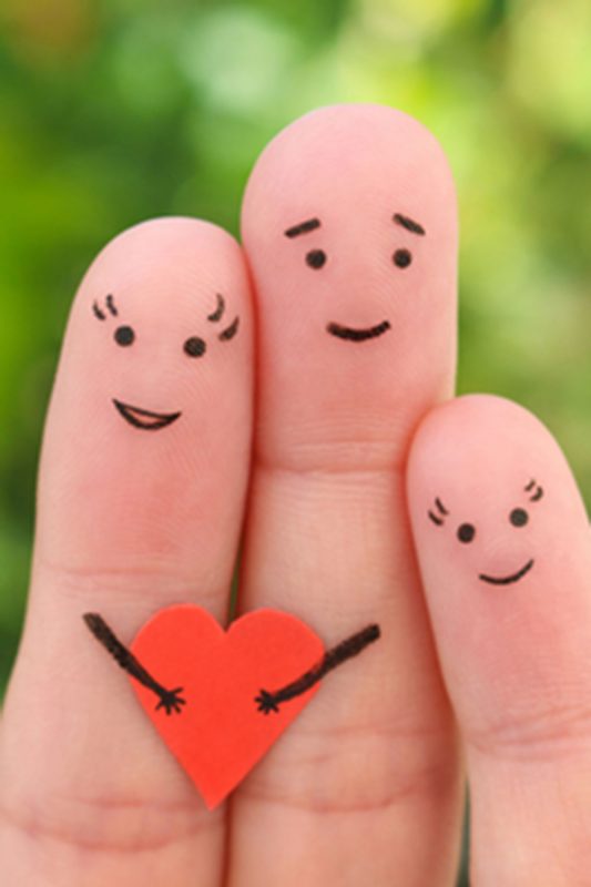 family of three fingers holding a heart