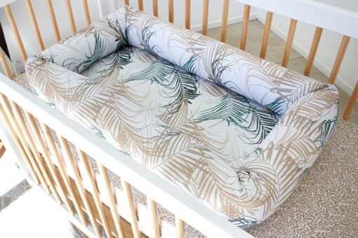 original cosy crib in plantation print in a cot