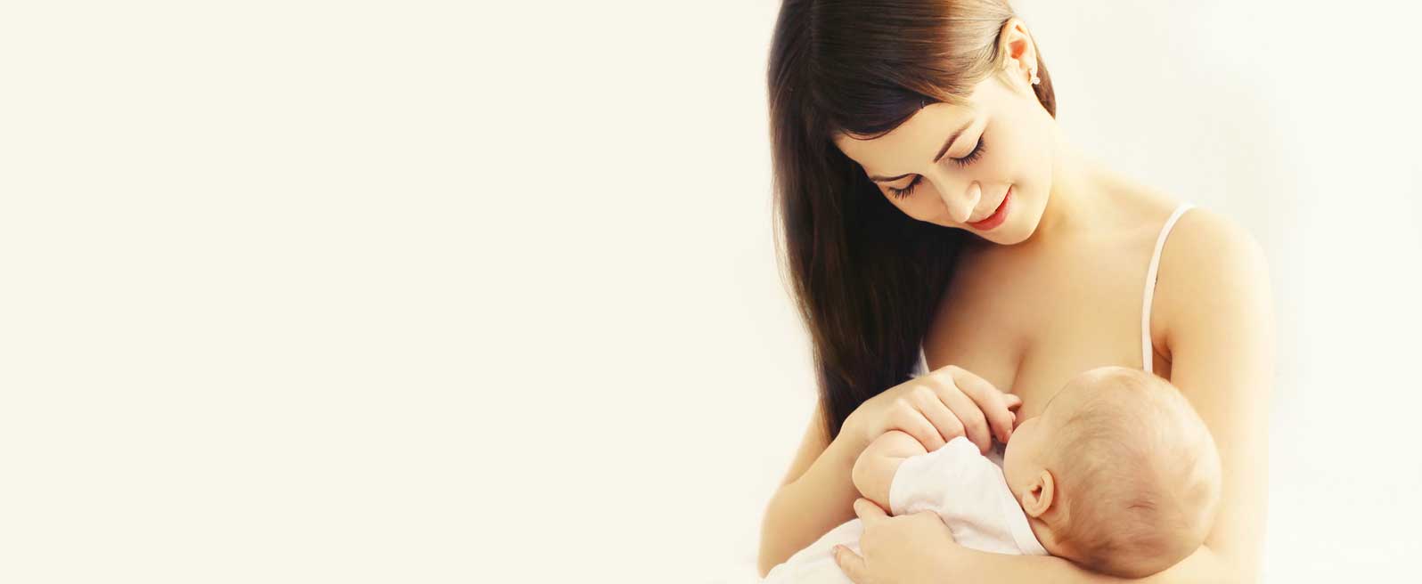 mum breastfeeding newborn